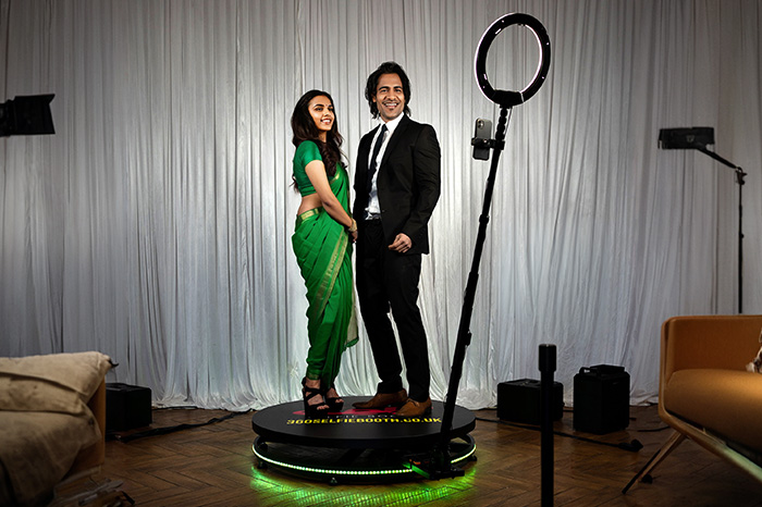 A couple posing for a 360-degree photoshoot in Coimbatore, with modern photography equipment by Bee Bee Videos.
