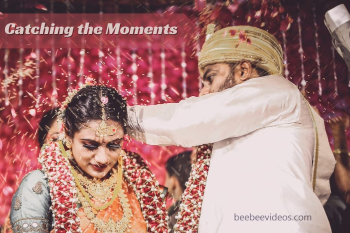 Bee Bee Videos captures a traditional garland ceremony at a Coimbatore wedding, with a cascade of rose petals creating a magical moment.