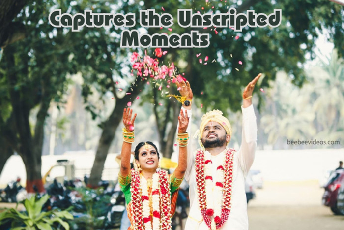 Joyful bride and groom in traditional wedding attire throwing flower petals in the air, a spontaneous moment beautifully captured by Bee Bee Videos in Coimbatore