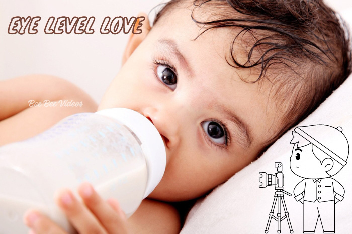 Infant enjoying a bottle, captured at eye level in Bee Bee Videos' Kids Photography session, Coimbatore