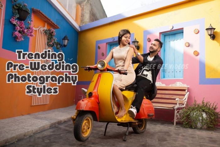 Vibrant and playful pre-wedding photography by Bee Bee Videos in Coimbatore, featuring a couple on a colorful scooter against a brightly painted backdrop, showcasing trendy pre-wedding photography styles