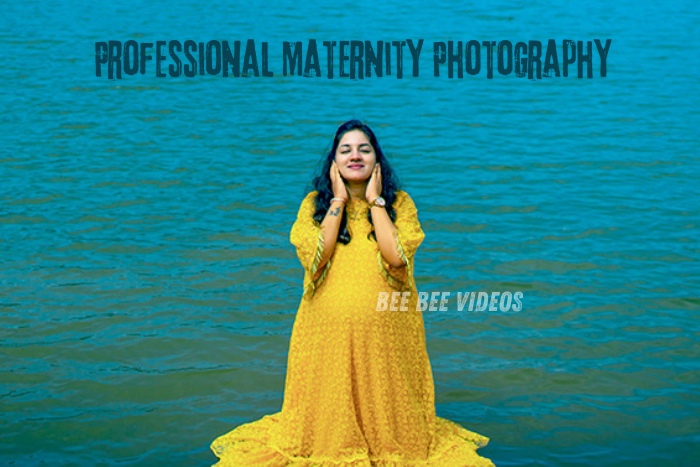 Pregnant woman in a vibrant yellow dress standing by the water, showcasing professional maternity photography, captured by Bee Bee Videos, premier maternity photographers in Coimbatore