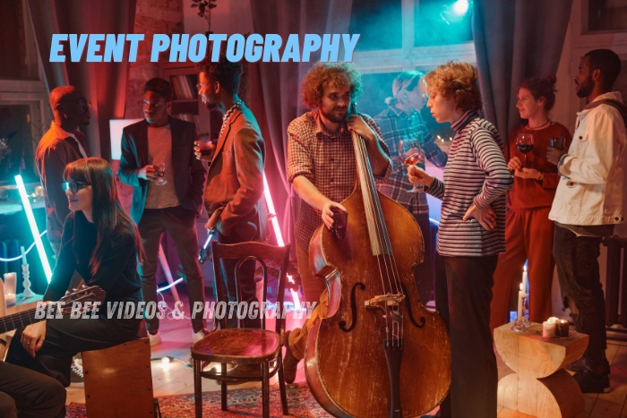 Group of people enjoying a lively event with a musician playing a double bass, captured by Bee Bee Videos & Photography in Coimbatore, showcasing the vibrant atmosphere and professional event photography services