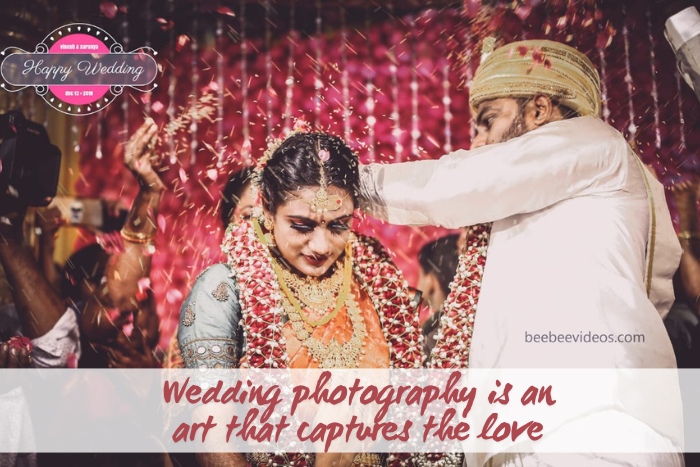 A bride and groom are showered with flower petals during a traditional Indian wedding ceremony, captured by Bee Bee Videos & Photography in Coimbatore. This vibrant moment showcases the artistry of wedding photography, highlighting the love and joy of the special day