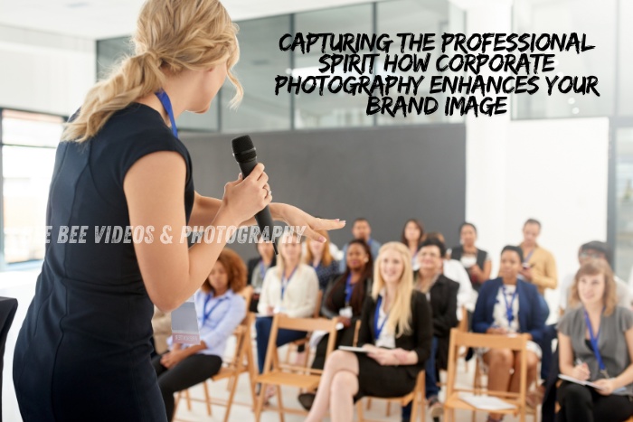 Female speaker presenting to a diverse group of professionals at a corporate event in Coimbatore, captured by Bee Bee Videos & Photography, highlighting the professional spirit and the impact of corporate photography on enhancing brand image