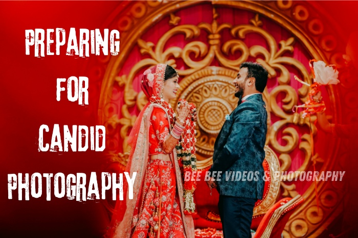 Bee Bee Videos & Photography in Coimbatore: Capturing genuine moments of a joyful couple in traditional wedding attire against a vibrant red backdrop, perfecting candid photography preparations