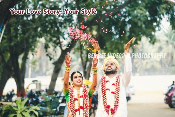 Joyful outdoor wedding moment captured by Bee Bee Videos & Photography in Coimbatore. Bride and groom showering petals