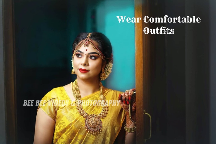 A traditional South Indian bride in a yellow saree, captured beautifully during her bridal photo shoot in Bee Bee Videos & Photography