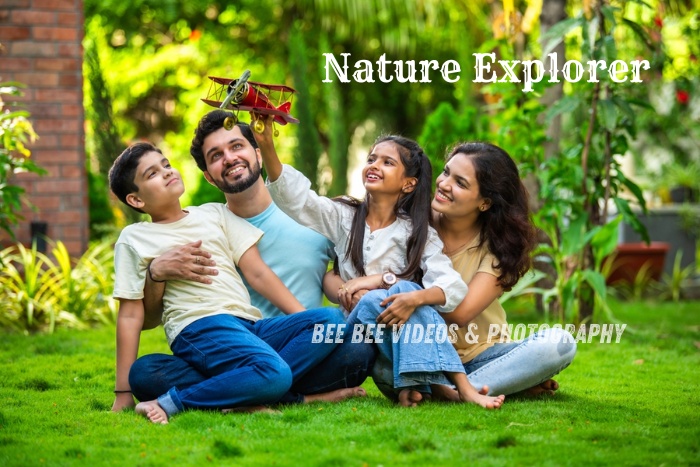 Joyful outdoor family photography with kids playing in lush green garden by Bee Bee Videos & Photography